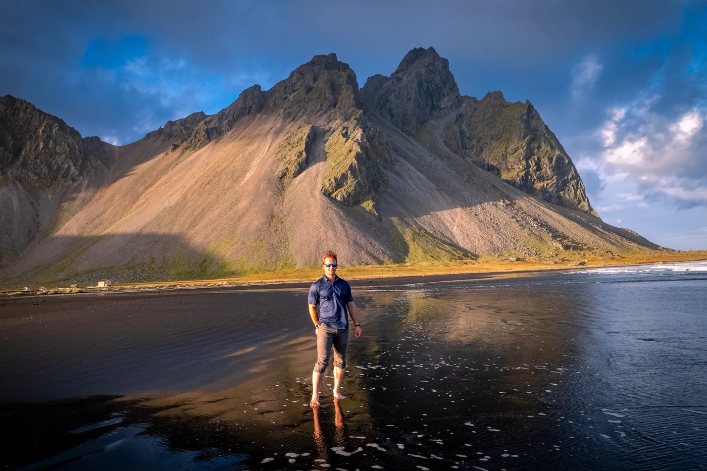 Wyatt Bange on a black sand beach in Iceland